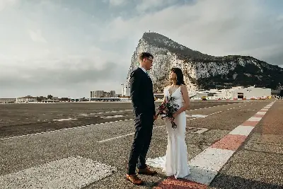 Wedding couple near Gibraltar runway by Radka Horvath Photography